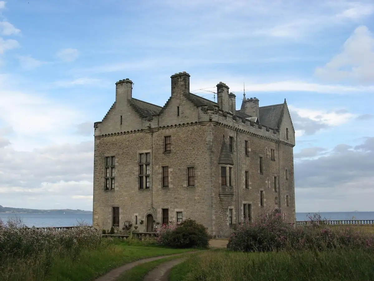 Stone tower house of Barnbougle Castle on the shore of the Firth of Forth
