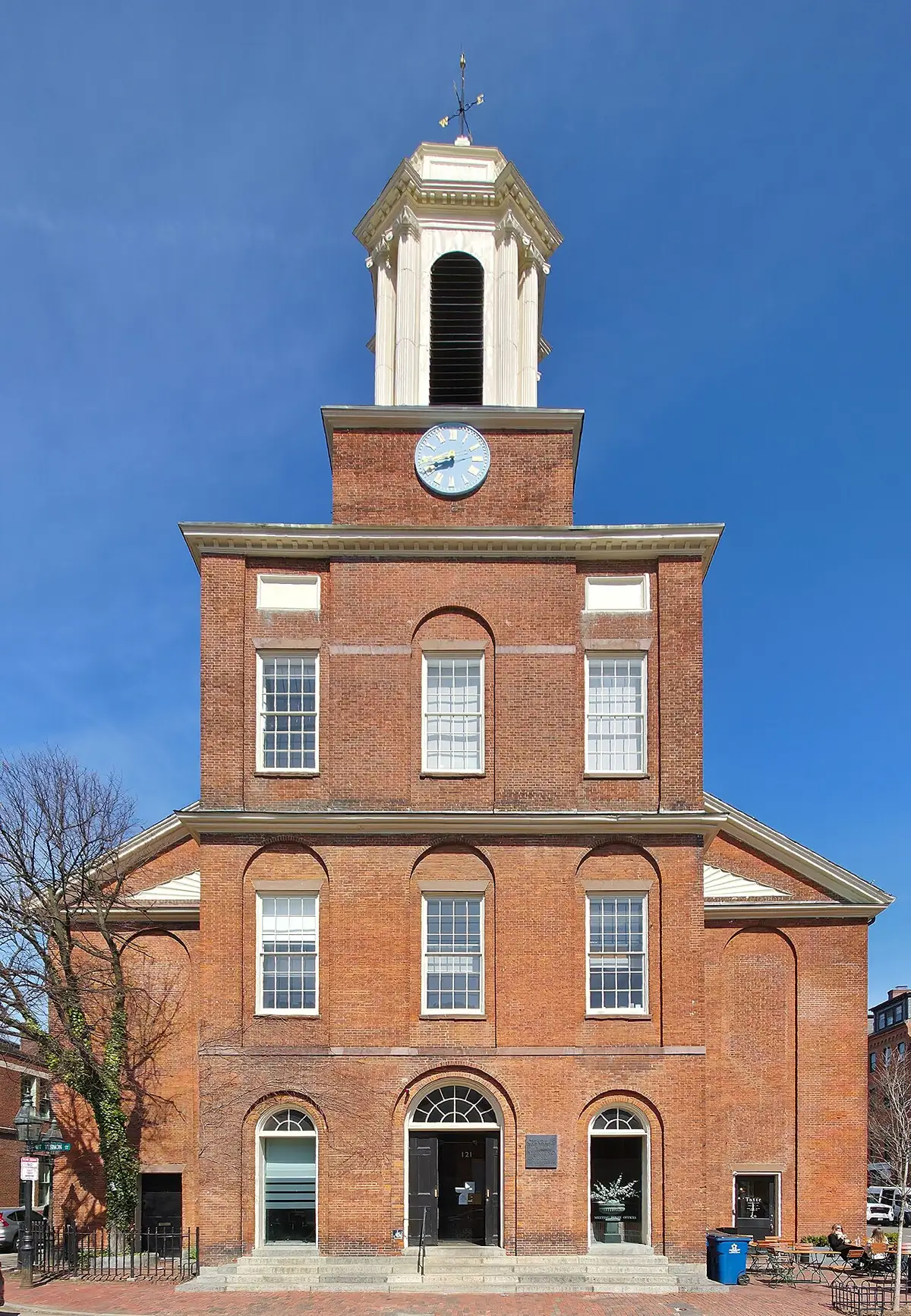 Brick Charles Street Meeting House with its white clock tower in Boston