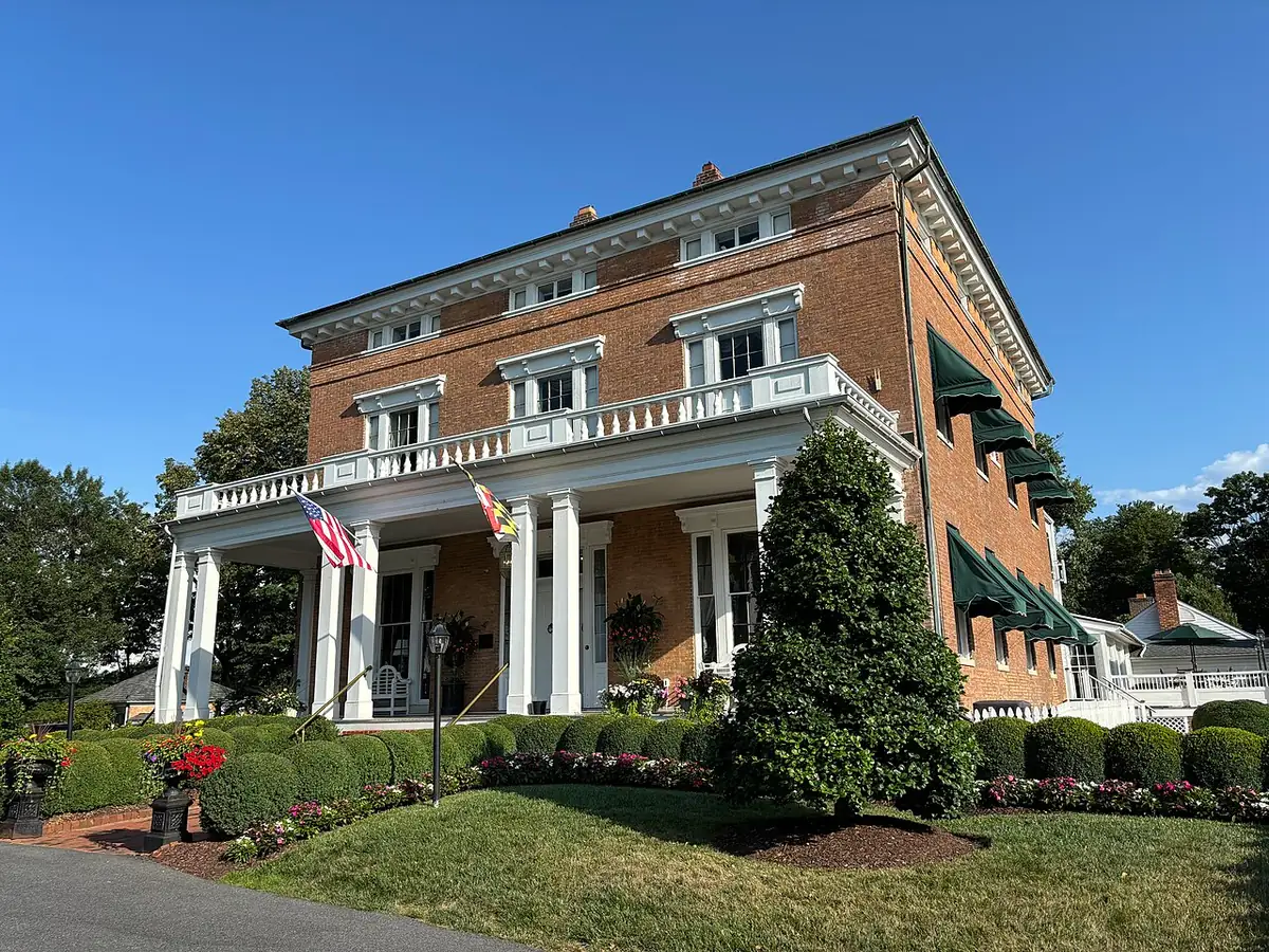 Brick Antrim 1844 mansion with its columned porch in Taneytown