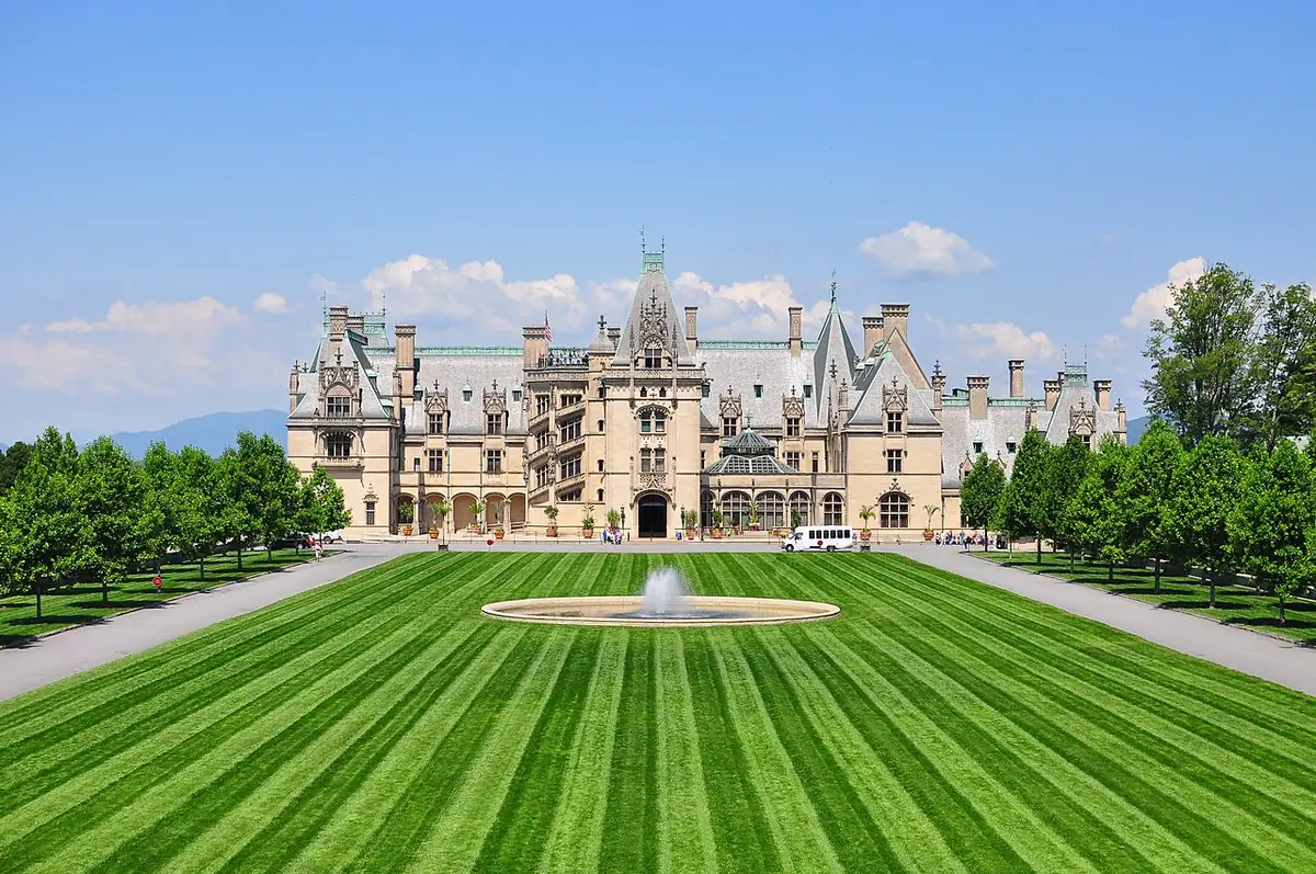 Main facade of Biltmore House seen across the long front lawn and fountain