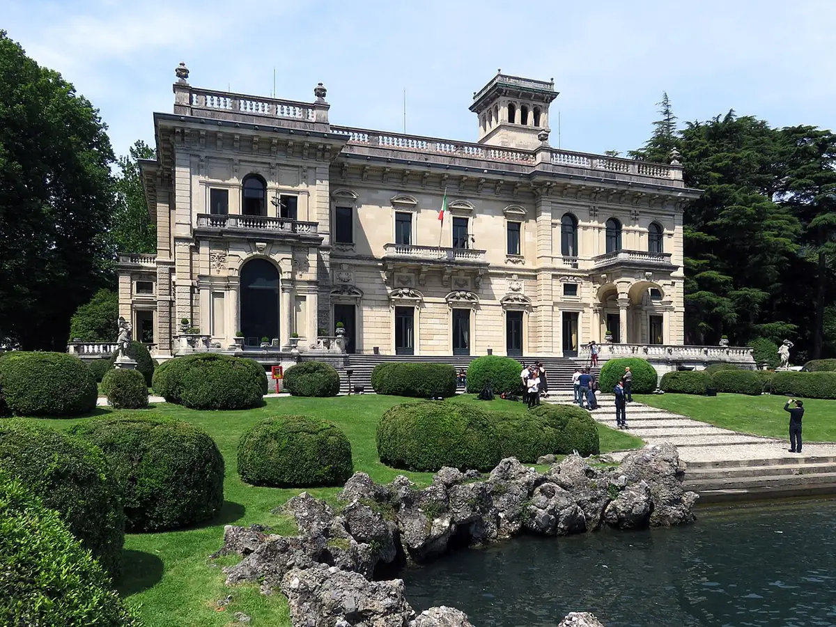 Ornate facade of Villa Erba above its lakeside garden in Cernobbio