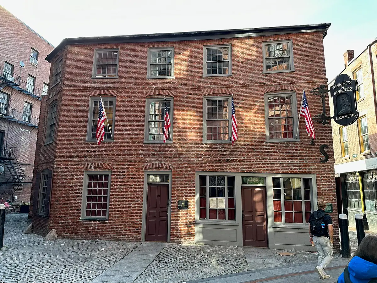 Three-story brick Ebenezer Hancock House on a cobbled lane in downtown Boston