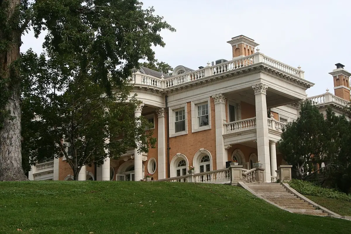 Beaux-Arts Grant-Humphreys Mansion with columned portico on a grassy rise in Denver